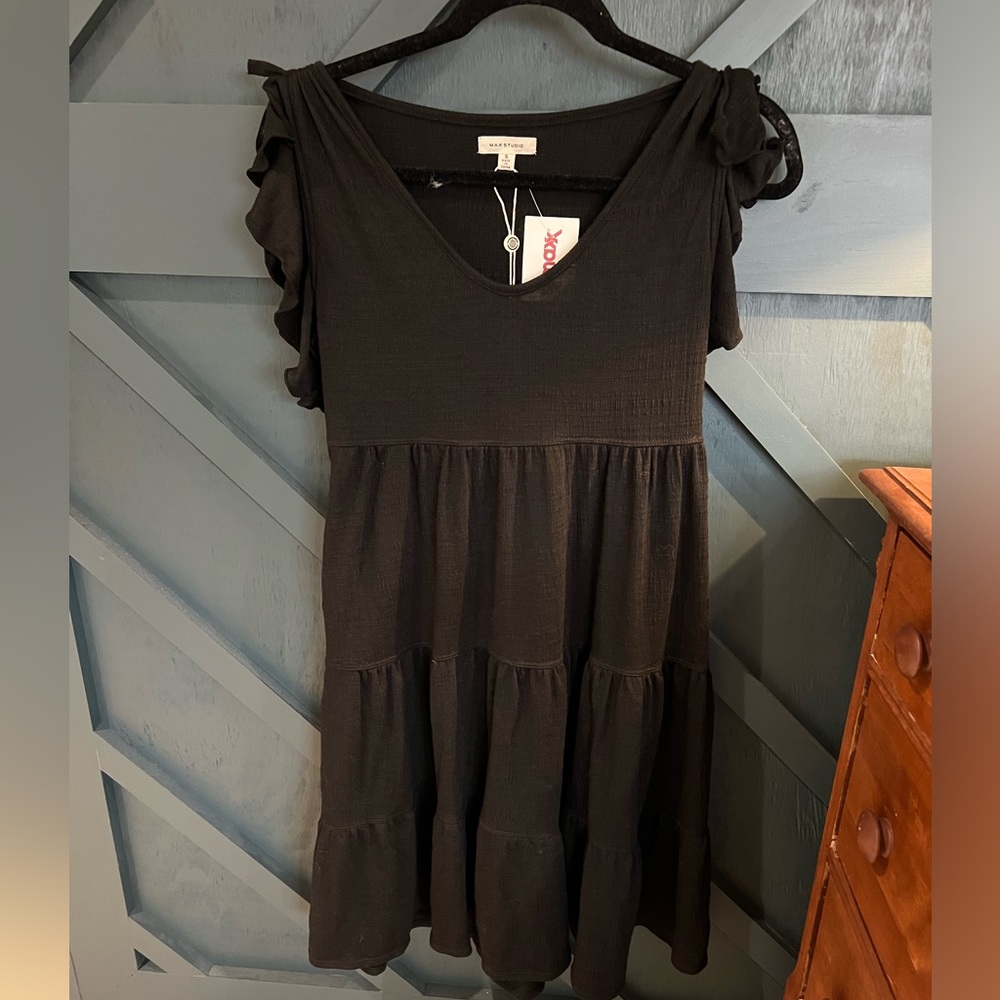 A tiered babydoll dress with fluttery sleeves
36” length